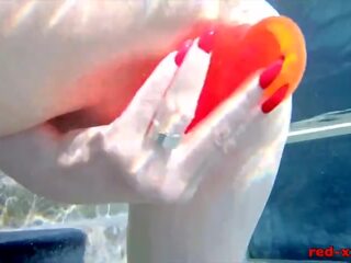 Busty redhead wife masturbates while outside in the pool adult video shows